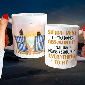 Sitting Next To You Doing Absolutely Nothing, Personalized White Mug, Couple Hand In Hand, Gift For Couple - Coffee Mug - GoDuckee