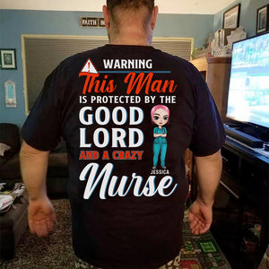 Personalized Nurse's Husband Shirts - Warning This Man Is Protected By The Good Lord And A Crazy Nurse - Shirts - GoDuckee
