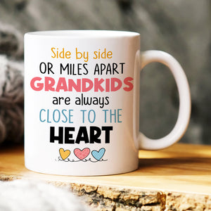 Side By Side Or Miles Apart Grandkids Are Always Close To The Heart, Family Grandkids White Mug - Coffee Mug - GoDuckee