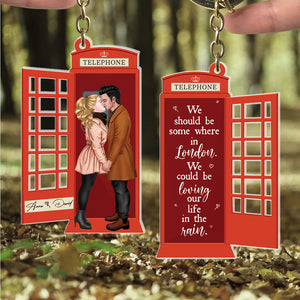 We Could Be Loving Our Life In The Rain, Personalized Kissing Couple At Telephone Booth Keychain, Gift For Couple, Valentine's Gifts - Keychains - GoDuckee