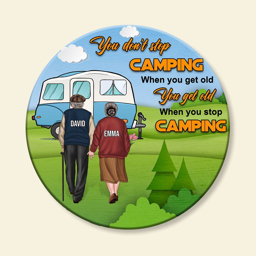 You Get Old When You Stop Camping - Personalized Round Wooden Sign - Gift For Couple - Old Couple Hand In Hand Back View - Wood Sign - GoDuckee
