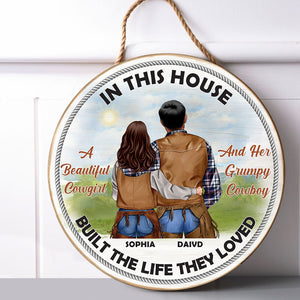 Cowboy Couple In This House They Built The Life They Loved Personalized Round Wooden Sign - Wood Sign - GoDuckee