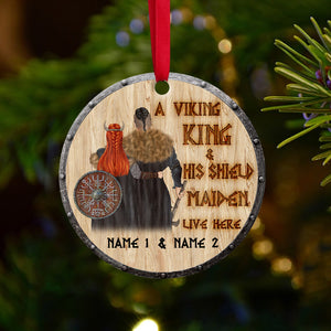 A Viking King And His Shield Maiden Live Here - Personalized Viking Ornament, Christmas Gift For Viking Couple - Ornament - GoDuckee